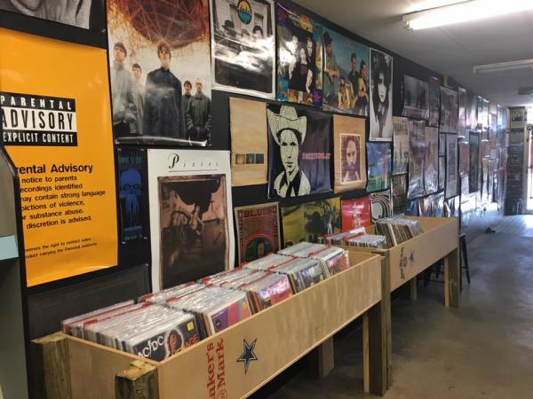 Photo of records and music posters at Growl Records