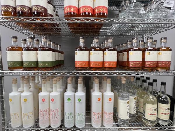 Noble Cut Spirits lined up on a rack in the distillery