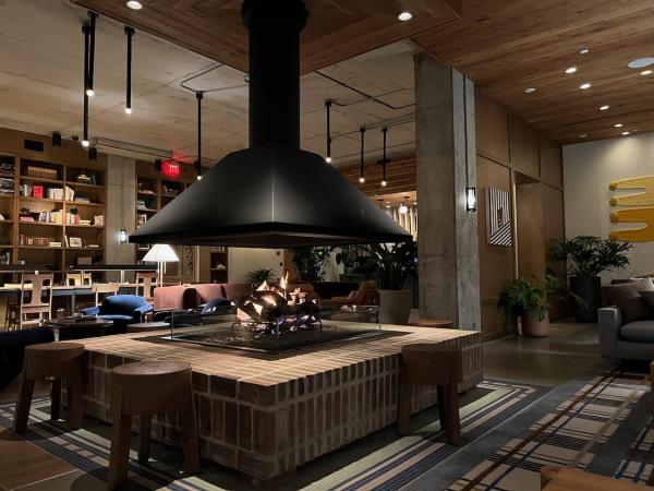 Photo of the fireplace in the lobby of the The Junto Hotel.