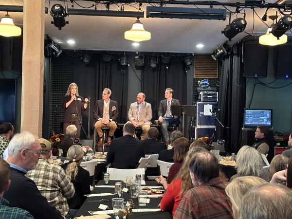 Linda Jurek introduces the panel to the crowd at the Legislative Luncheon