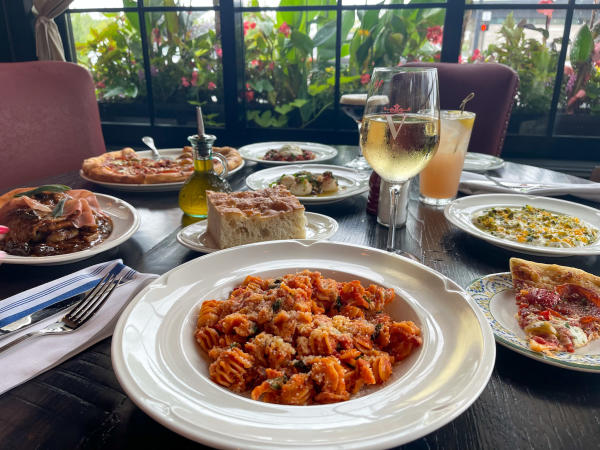 A table at Valentina's full of Italian food.