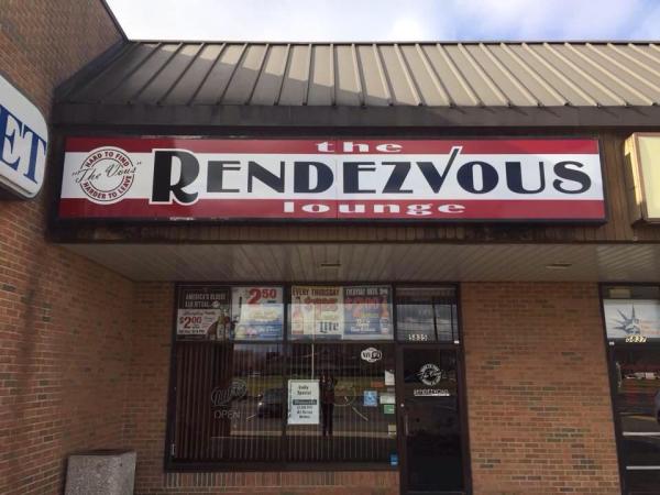 The Rendezvous Lounge exterior with red and white sign