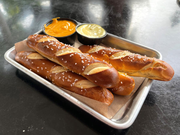 4 Soft pretzel sticks on a plate at North High Brewing.