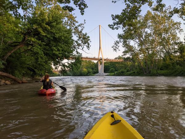 On the water in a kayak with the Dublin Link pedestrian bridge in the distance.