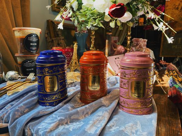 Three tea canisters on a table