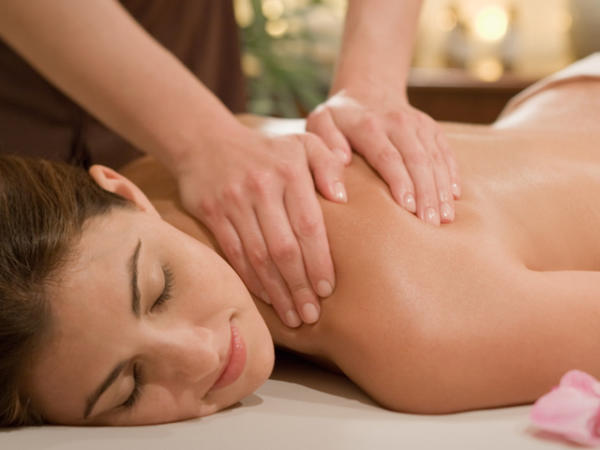 Woman getting a massage at the Woodhouse Day Spa