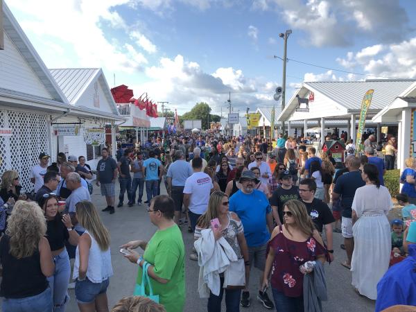 Fairgoers strolling down food alley at the Elkhart County 4-H Fair