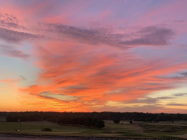 Purple sky at sunrise above the farmlands in Middlebury, Elkhart County, IN