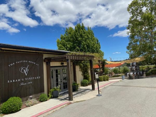 View of Sarah's Vineyard tasting room entrance from the outside on a sunny day