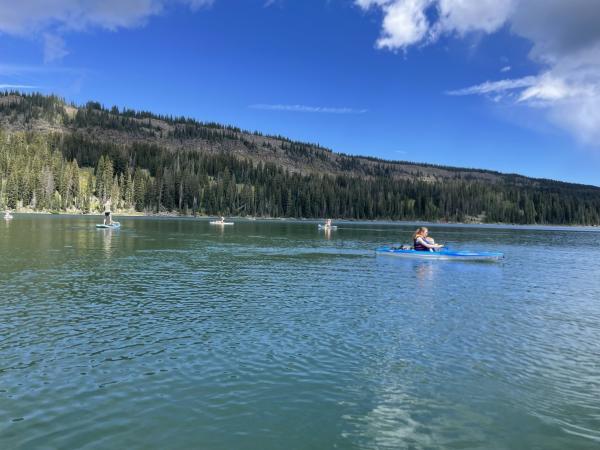group of people paddle-board on the Grand Mesa