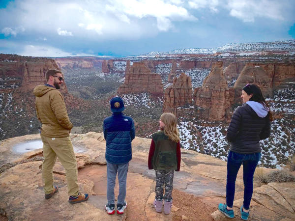 Family Standing and overlooking the Colorado National Monument