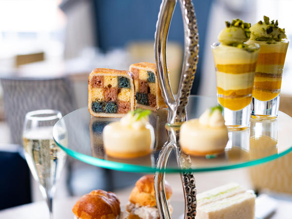 A picture showing afternoon tea cakes on a stand