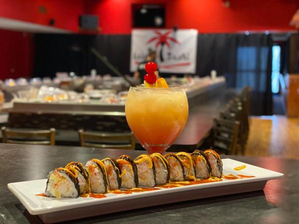 Island Sushi roll and cocktail on table