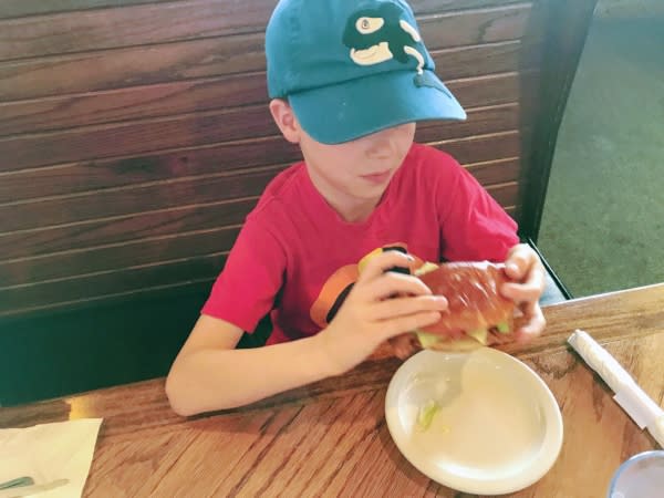 Kid eating tenderloin