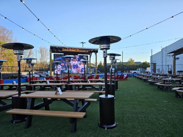 Outside the patio at Field Day in Huntsville, Alabama with tons of seating and a giant tv screen