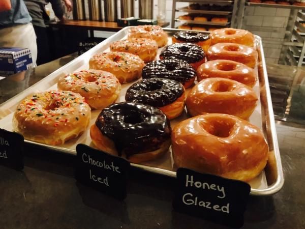 Doughnuts from Status Dough come with a variety of toppings, including sprinkles, chocolate iced and honey glazed.