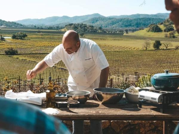 Chef Nash Live Cooking Class Outside In front of a Field