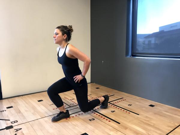 Instructor demonstrates a lunge