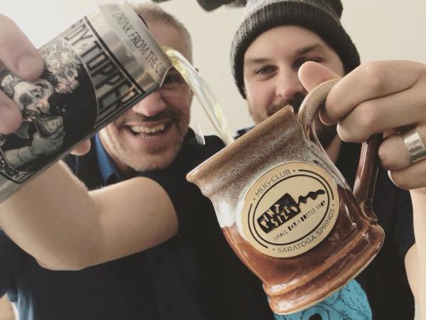 Pint Sized guy pouring beer into a mug