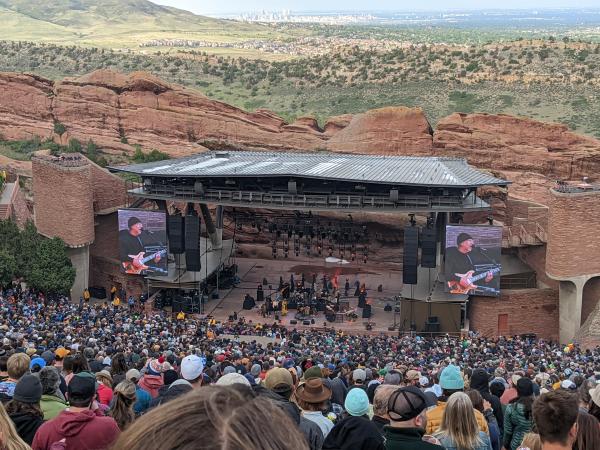 A crowd watches a concert at Red Rocks Park and Amphitheatre in Jefferson County, Colorado