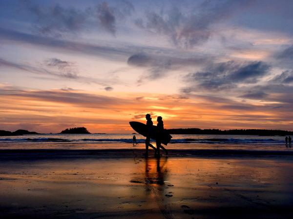 Paddleboarders at sunset