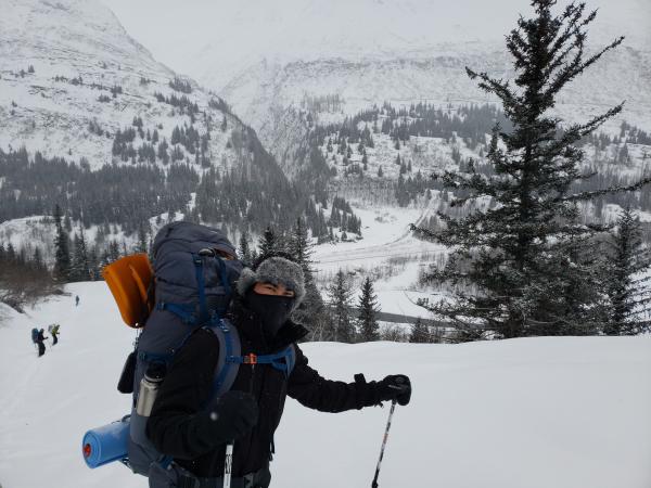 Man in snow-shoes and back-pack