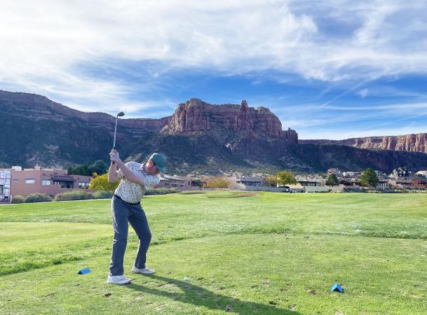 Person Swinging Golf Club at Tiara Rado