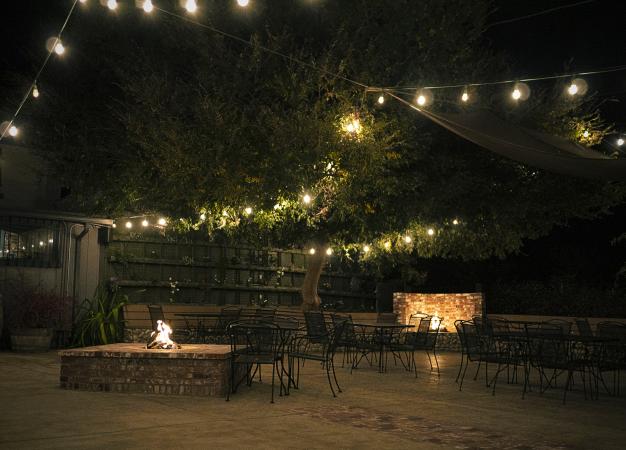 Open Patio at night with lights and fireplace