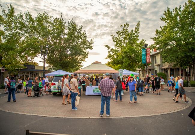 Customers shop at vendor booths at Old Town Clovis Farmers Market