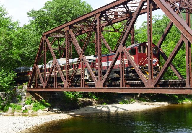 Hobo Railroad Crossing An Iron Truss Bridge Above River