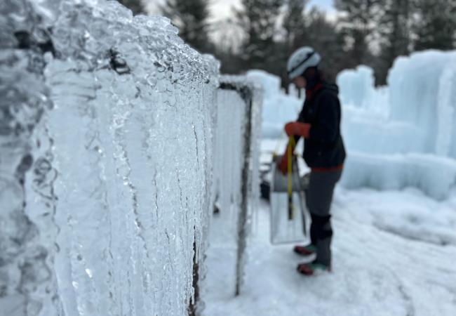 Close up of icicles hanging from metal pipes