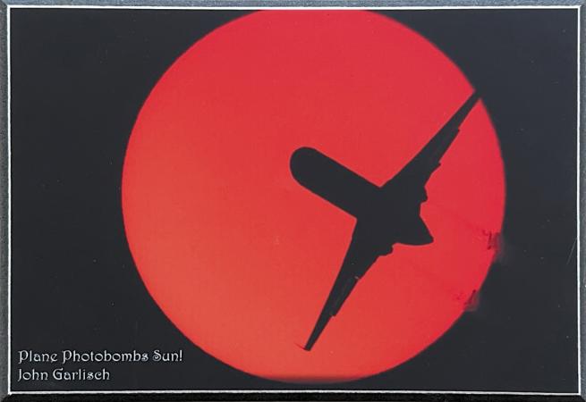 Plane Photobombs Sun By John Garlisch