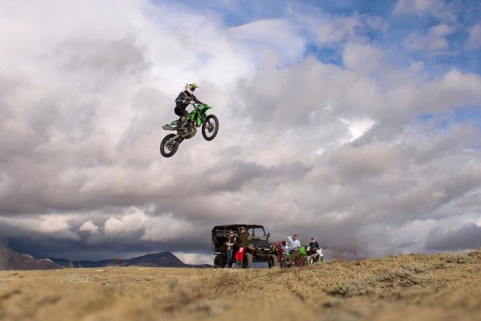 Person Jumping on a Motorcycle outside of Grand Junction