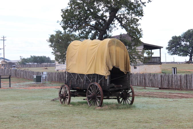 A covered wagon at Fort Martin Scott