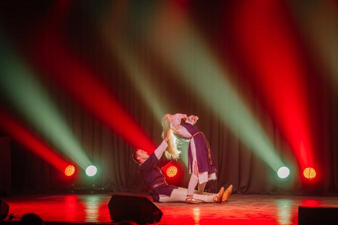 A man and woman performing on stage