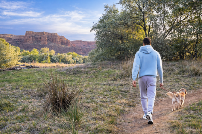 Man and Dog walking in Kindred Park