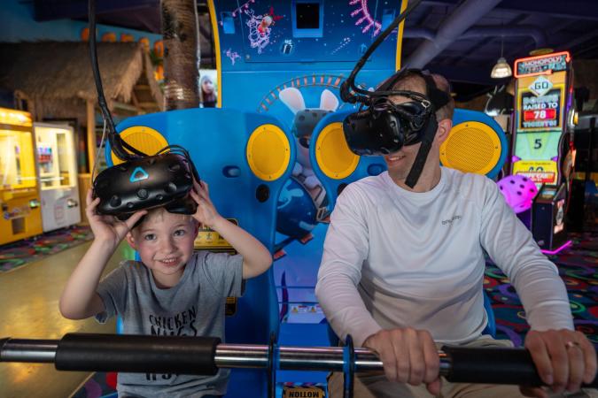 Father and Son Playing Arcade Games at Bananas Fun Park