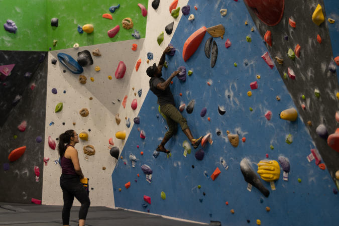 Two people climbing at Grand Valley Climbing Gym