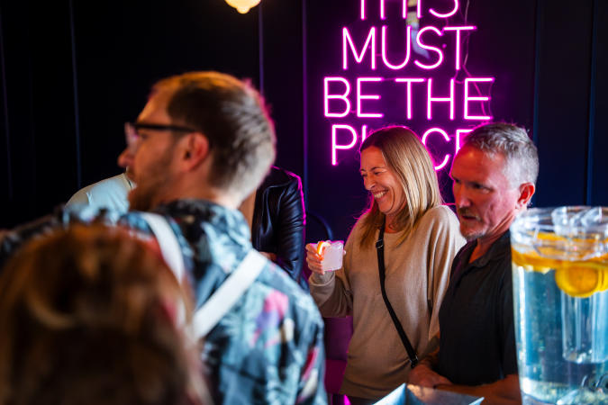 People laughing at Melrose Spirit Co.