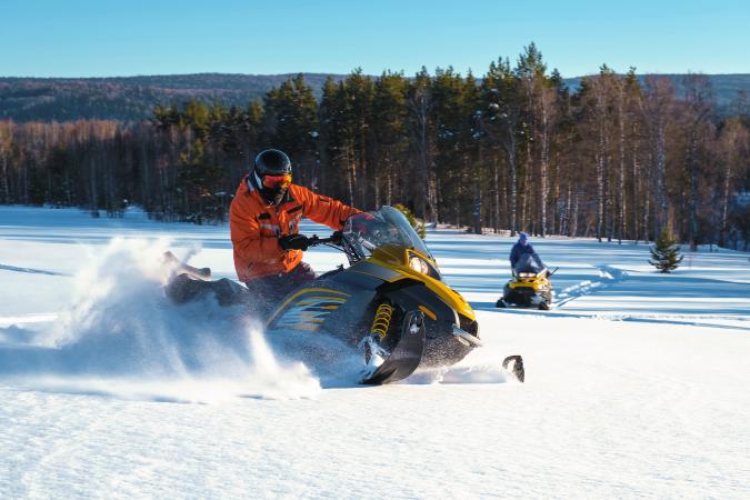 Person on Snowmobile in the Snow