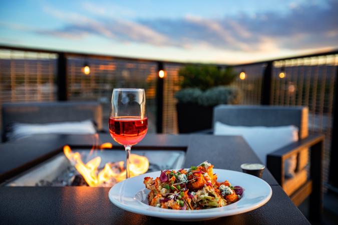 Plate and Wine next to Fire on Devil's Kitchen Patio