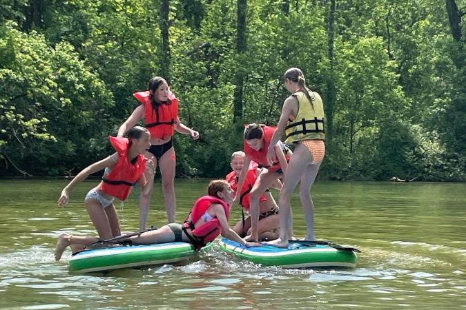 Kids at play on paddle boards