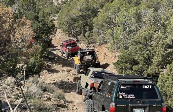 Picture of Four Jeeps Driving Up a Rocky Hill