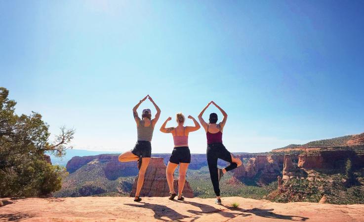 Women Posing in front of Colorado National Monument