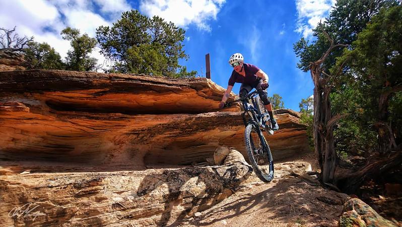 Person on Bike Dropping off a Rock