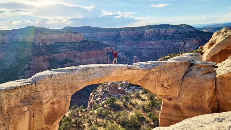 Man Standing on top of Rattlesnake Arches