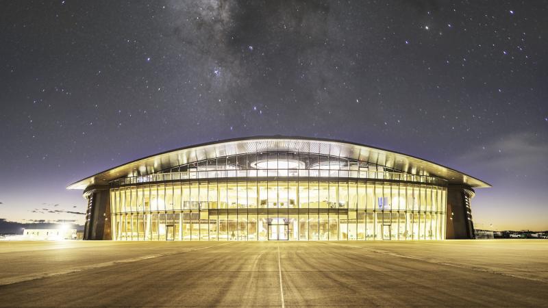 The exterior of Spaceport America lit up at night
