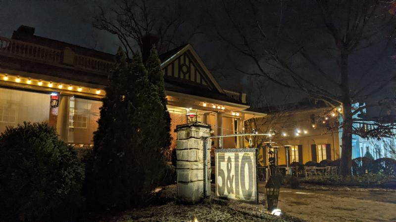 The front of Five & Ten restaurant is shown at night.