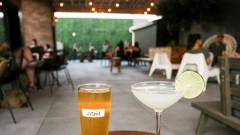 A beer flight and cocktail on the rooftop of Antiques on High