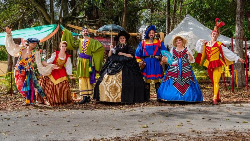 Cast of characters from the Renaissance Festival dressed in colorful renaissance costumes